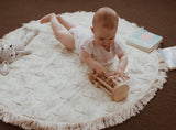Baby playing with a Beechwood Rolling Rattle